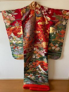 The ancient beauty of Japan can be enjoyed from various angles in this uchikake. The vivid colors of this piece add a touch of color to your special day. Height (from the back) about 180 cm Length from sleeve to sleeve: about 65 cm Condition:Please see photos. ☆ This is a very gorgeous Uchikake. This is the highest rank of Japanese kimono, so it is recommended as a gift. The gorgeous patterns and embroidery can be used as a decoration for Japanese room interior ☆ Thank you for visiting my page. My store owns a lot of unique items that you won't see in other stores. You won't regret it! Please see photos for details. If you have any questions, feel free to ask me. Traditional Red Kimono For Tea Ceremony, Traditional Red Kimono For Wedding, Traditional Red Silk Kimono, Elegant Red Kimono For Wedding, Kimono Outfit Japanese, Maiko Kimono, Japan Clothing, Kabuki Costume, Pretty Kimonos