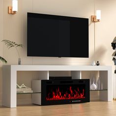 a television stand with a fire place in the center and a large screen on top