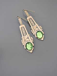 "Vintage Jewelry - Art Deco Inspired Earrings - Crystal Earrings - Bridal Earrings - Gold Earrings - Green Earrings - handmade Jewelry So gorgeous! Awesome Art Deco inspired earrings embellished with three sparkling green vintage crystals. Gold plated. Would be perfect for your wedding. Chloe says, \"Wear them and feel fabulous!\" They measure just over 2 1/2\" long. Thanks for visiting Chloe's" Green Art Deco Drop Earrings, Art Deco Style Matching Metal Earrings, Art Deco Sterling Silver Dangle Earrings, Art Deco Green Jewelry For Pierced Ears, Art Deco Hallmarked Drop Earrings, Nickel-free Dangle Earrings In Art Deco Style, Nickel-free Dangle Art Deco Earrings, Nickel-free Art Deco Dangle Earrings, Handmade Brass Art Deco Earrings