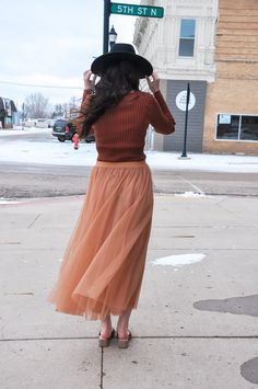 The Elastic Waist Maxi Tulle Skirt is a stunning and versatile addition to your wardrobe. This maxi skirt combines elegance with comfort, making it perfect for a wide range of occasions. Featuring an elastic waist, it offers a customizable and comfortable fit. The skirt is finished with a raw hem, which adds a contemporary touch to its overall design. It is fully lined, both in the body and skirt, providing comfort and coverage. Crafted from 100% polyester for both the self and lining, this skir Modest Midi Skirt For Fall, Modest Fall Skirt, Stretch Midi Skirt For Fall, Chic Tiered Skirt For Fall, Modest Fall Skirt With Elastic Waistband, Chic Non-stretch Tulle Skirt, Tiered Maxi Skirt For Fall Party, Winter Midi Skirt With Elastic Waistband, Fall Tiered Skirt With Elastic Waistband