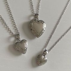 SIZE: chain length is 40cm plus a 5cm extension piece. in the images i am wearing the locket necklace on the last clasp. - small locket: 1 x 1 cm - medium locket: 1.3 x 1.3 cm - large locket: 2 x 2 cm MATERIAL: chain, rings, and charm are all rhodium plated brass (hypoallergenic & tarnish resistant). all materials are from ethical and sustainable sources. POSTAGE INFO: this necklace is handmade with love by me in perth, western australia. PACKAGING: all jewellery is placed inside a storage box and packaged in cardboard and paper packaging. STORAGE & CARE: store your jewellery in a cool, dry place, away from moisture. although all earrings are tarnish resistant, try to avoid contact with chlorinated water and perfumes. MATCHING EARRINGS: https://www.etsy.com/au/listing/1033665816/ Luxury Silver Locket Necklace, Cheap Spiritual Locket Necklace, Cheap Silver Round Locket Necklace, Small Silver Locket, Cute Necklaces Silver, Locket Necklace Aesthetic, Heart Locket Necklace Silver, Heart Lock Necklace, Locket Necklace Silver