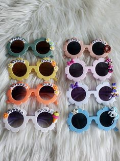 How adorable are these sunnies!? Perfect for the summer sun! These custom sunglasses make the perfect gift or grab a pair for your little one! Each pair is handmade. Approx 5in wide across front of glasses Fun Handmade Sunglasses As A Gift, White Cute Sunglasses For Birthday, Cute Polarized Sunglasses As Gift, Playful White Sunglasses As Gift, Playful White Sunglasses For Gifts, Cute White Sunglasses As A Gift, Playful White Sunglasses For Gift, Cute White Sunglasses As Gift, Fun Sunglasses With Gradient Lenses For Gift