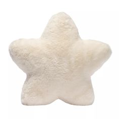 a white star shaped pillow on a white background