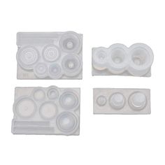 four pieces of white plastic with circles on them