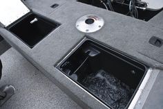 the inside of a boat with two sinks and an air vent on the front end