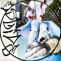 a man laying down on top of a slide