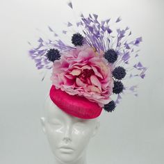 Handmade by Featured Milliner of The Kentucky Derby Museum 2023 & 202 Pink peony with light purple feather burst & dark purple pops. Gorgeous garden-like Kentucky Derby Fascinator.  Attaches with elastic.  Not taking customs this year--Derby 150 is going to be massive and mom life keeps me running! However, happy to suggest pieces that will coordinate with your outfit. If you don't love the way this attaches to your head--message me!  I can swtich *most* pieces to your preference. Clip, Headband Purple Feather Headpieces For Spring, Purple Fascinator With Handmade Flowers For Spring, Purple Mini Hats With Feathers For Kentucky Derby, Purple Spring Fascinator With Handmade Flowers, Purple Handmade Flowers Headpiece For Kentucky Derby, Purple Headpiece With Handmade Flowers For Kentucky Derby, Handmade Purple Flower Fascinator For Spring, Summer Purple Feathered Fascinator, Purple Feathered Mini Hats For Kentucky Derby