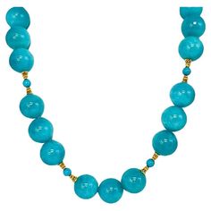 This stunning statement necklace features a beautiful collection of perfectly matched, 18mm round amazonite beads with vibrant, gorgeous color! The large amazonite beads are paired with smaller turquoise beads and decorative 18k yellow gold embellishments that give this strand a rich and luxurious feel. A beautiful clasp adds the perfect finishing touch to this impressive necklace that is sure to turn heads! Necklace measures 21.5 inches in length. Luxury Yellow Round Beaded Necklaces, Luxury Gold Statement Beads, Elegant Amazonite Bead Necklaces, Elegant Amazonite Beaded Necklace, Elegant Round Amazonite Necklace, Elegant Blue Gemstone Beaded Necklaces, Elegant Blue Amazonite Beaded Necklaces, Elegant Turquoise Gemstone Necklace With Round Beads, Turquoise Faceted Amazonite Jewelry