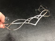 I have fabricated a sterling silver Celtic and Elvish inspired bridal tiara which is designed to be worn for a wedding, a Renaissance event, or hand-fasting ceremony. An artisan circlet with a Middle Earth feel! This piece can be unisex and comes without a gemstone. This piece will fit 3/4's around the head and is tied off, in the back, by an elastic jeweler's cord so that it will remain snug and in place while in motion. This works better than using a chain link, which can leave a circlet too t Elegant Silver Headpiece With Teardrop Crown, Elegant Silver Teardrop Crown Headpiece, Silver Crown Headpiece For Wedding, Elegant Adjustable Silver Headpieces, Elegant Adjustable Jewelry For Ceremonies, Elegant Silver Crown Headband, Elegant Silver Headband For Wedding, Elegant Silver Headpieces For Gifts, Adjustable Silver Crown Headpiece