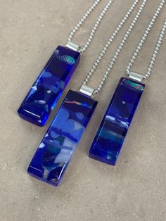 "Colorful waves of cobalt blue and white glass combine with shimmery bands of dichroic and iridescent glass to create the impressionistic pendant on this necklace. The depth and variety of colors in the glass create a striking, one-of-a-kind kiln-fired pendant. Glass is kiln fired, shaped with beveled edges, and then fire polished in my glass studio. Pendant hangs from a sterling silver bail on a sterling silver bead chain. Pendant is also available in green, olive green, turquoise, black and si Colorful Waves, Beady Eye, Glass Garden Art, Rainbow Glass, Glass Studio, White Eyes, Green Olive, Bead Chain, Silver Bead