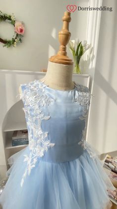 ☁💙 Sky Blue Dream Delivered! 💫 Your little princess will twirl in delight wearing this short flower girl dress. Featuring a sky-blue satin top, a ruffled tulle skirt, and delicate white appliques, it's pure magic. With options in 60 enchanting colors and 14 sizes, you can customize this dress to perfection. Make her moment unforgettable in this whimsical gown! 🌟 #FlowerGirlDress #SkyBlueElegance #RuffledSkirt #CustomColors Sleeveless Bridesmaid Princess Dress With Lace Trim, Spring Bridesmaid Princess Dress With Lace Trim, Light Blue Tulle Dress With Floral Applique, Light Blue Tulle Princess Dress With Ruffles, Spring Confirmation Dress With Lace Bodice, Blue Floral Applique Dress For Dress-up, Spring Bridesmaid Princess Dress With Floral Applique, Sleeveless Ruffled Bridesmaid Princess Dress, Spring Light Blue Princess Dress With Ruffles