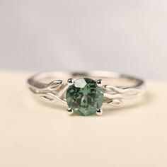 a green ring sitting on top of a table