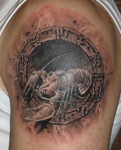 a man's arm with a tattoo on it that has an image of a wolf in