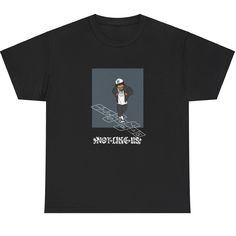 a black t - shirt with an image of a man on a skateboard