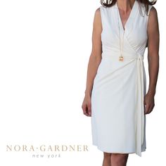 A Sleeveless Wrap Dress Featuring A Hidden Tie On The Inside,A V Neckline And A Self Side Tie Measurements: (0) 33", Waist 26" (2) Bust 34", Waist 27", (4) Bust 35", Waist 28" (6) Bust 36", Waist 29" Fabric Content: 79% Viscose, 13% Polyester, 7% Polyamide, 1% Elastane Elegant Off-white Sleeveless Midi Dress, Sleeveless Wrap Dress, White Cream, Cream White, V Neckline, Wrap Dress, Womens Dresses, Customer Support, Fast Delivery