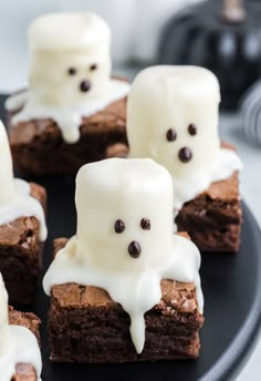 chocolate brownies with marshmallows and ghost faces on them