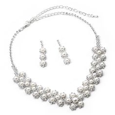 This bridal wedding jewelry set is simply stunning! This beautiful jewelry set is encrusted with clear, sparkling rhinestones in a sophisticated and elegant design. The necklace measures approximately 12" long with a 4.5" extender Chain for just the right fit. The matching Earrings measure approximately 1.5"long. This set is perfect for brides, bridesmaids, pageants or any special event. This set coordinates with any color or style wedding dress or formal ensemble. Rhinestone Metal Jewelry Sets For Weddings, Wedding Rhinestone Metal Jewelry Sets, Bling Metal Jewelry Sets For Wedding, Metal Bridal Necklace With Rhinestones For Wedding, White Metal Jewelry Sets For Wedding, Wedding Jewelry Sets With Bling And Metal, Bridal Metal Necklace With Rhinestones For Wedding, Wedding Jewelry Sets With Bling, White Metal Wedding Jewelry Sets