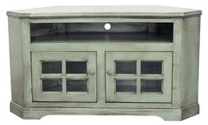 an entertainment center with glass doors on the front and side panels, in grey finish