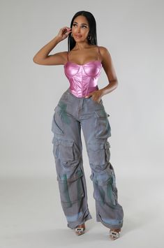 a woman in pink top and grey cargo pants