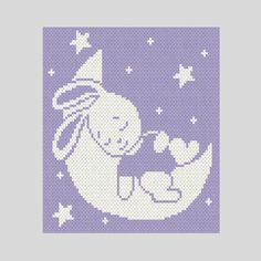 a cross stitch pattern with an image of a cat sitting on the moon and stars