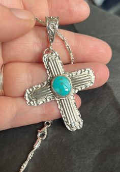 Handcrafted Zia style pendant that I have attached to a sterling silver textured backplate. In the center I have set a small Royston turquoise stone.  Come with beautiful double twisted chain.  The bail is a filigree style work  The whole combination together is very boho and western. I love it. I hope you do as well.  Thanks for looking Unique Sterling Silver Cross Necklace, Bohemian Sterling Silver Cross Jewelry, Artisan Silver Cross Pendant Jewelry, Southwestern Style Silver Cross Necklace, Southwestern Style Silver Cross Necklaces, Southwestern Style Silver Cross Pendant Necklace, Handmade Silver Cross Turquoise Necklace, Silver Turquoise Cross Necklace For Gift, Handmade Turquoise Cross Jewelry