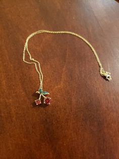 "This is the CUTEST necklace!! A 7mm and a 5mm round red CZs are the Cherries; the little leaves have green CZs set against black rhodium. *The stones are MUCH more sparkly than what shows in the photos* Entire piece is Sterling Silver layered with Yellow Gold Overall pendant measures 3/4\" x 5/8\" Hallmarked 925 FZN China Brand New Contact me with any questions" Red Jewelry With Adjustable Chain For Anniversary, Red Necklace For Christmas Anniversary, Red Charm Necklace With Adjustable Chain As A Gift, Red Charm Necklace With Adjustable Chain For Gift, Red Necklace With Adjustable Chain As Gift, Red Necklace With Adjustable Chain For Gift, Red Adjustable Chain Necklace As A Gift, Cherry Necklace, Rainbow Moonstone Ring