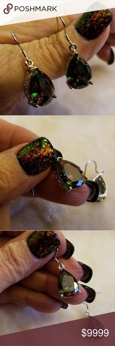 🌷 2/$20 💚💜Mystic Topaz Earrings2 👉REDUCED👈  💜💚Mystic Topaz Earwire Earrings2. Silvertone Setting. Gorgeous lab created stone. Dances of color. Pierced. Very Lightweight. 👉NWOT👈, never worn. Jewelry Earrings Elegant Multicolor Nickel-free Crystal Earrings, Adjustable Pierced Earrings For Parties, Party Jewelry With Iridescent Ear Wire, Iridescent Party Earrings, Nickel-free Crystal Earrings For Party, Nickel-free Round Crystal Earrings For Party, Iridescent Pierced Jewelry For Party, Multicolor Crystal Earrings For Evening, Adjustable Dangle Clip-on Earrings For Party