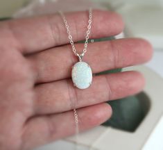 "Beautiful Large white lab-created opal pendant necklace. These gorgeous opals are very similar to natural mined opals. Lab-created opals contain 70-90% silica (from which natural opal is formed) and 10-30% resin. The resin makes the opal harder, stronger, unlike natural opals, which are known to be soft and fragile. Each opal displays a rainbow of color that sparkles with every catch of light. I've handset two different size opals in a solid sterling silver prong settings 16x12mm (5/8\" x 1/2\" White Opal Jewelry Gift, White Opal Round Pendant Necklace, White Opal Pendant Jewelry, White Opal Gemstone Necklace, White Opal Birthstone Jewelry, White Oval Opal Necklace, White Opal Necklace For Gift, Elegant White Pink Opal Jewelry, Opal Round Pendant Jewelry Gift