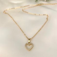 The delicate design of this necklace ensures that it seamlessly transitions from day to night, complementing any outfit with an understated grace. Whether you're dressing up for a special event or adding a touch of sophistication to your everyday look, this necklace effortlessly elevates your style. You will look adorable wearing this dainty heart necklace. The cute necklace you'll never want to take off. This is a nice Valentine's Day gift for her. Perfect as a layering necklace.  ♥ ITEM DETAIL Elegant Heart Pendant Necklace With Clavicle Chain, Delicate Heart Pendant Necklace With Heart Beads, Elegant Heart Beads Round Pendant Necklace, Elegant Heart Beads Necklace With Round Pendant, Elegant Heart Cut Charm Necklace With Heart Beads, Elegant Necklace With Heart Beads And Round Pendant, Delicate Double Heart Necklace For Her, Elegant Open Heart Charm Necklace For Her, Elegant Open Heart Charm Necklace As Gift For Her