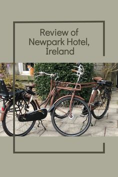 two bikes parked next to each other on a sidewalk with the words review of newport hotel, ireland