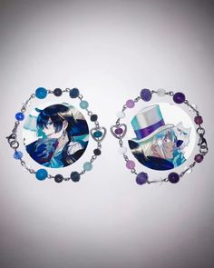 two necklaces with anime characters on them