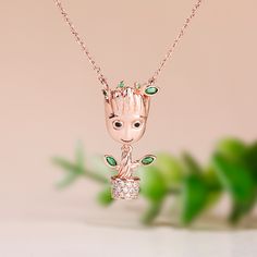 Each cartoon tree-inspired necklace is made of sterling silver, partially inlaid with white and green gemstones, designed so cute and super adorable. If you or someone you love is a baby tree at heart, each necklace is a must-have piece in your jewelry collection!Weight: 5.6 gWidth: 12.5 mmHeight: 25.9 mmThickness: 7.3 mmMaterial: 925 SilverPlating Color: Rose GoldLength: 450 mm Cute Green Jewelry Gift, Green Sterling Silver Necklaces With Charms, Green Sterling Silver Necklace With Charms, Cute Rose Gold Sterling Silver Jewelry, Cute Green Necklace For Gifts, Cute Green Necklace For Gift, Whimsical Green Charms Jewelry, Whimsical Green Jewelry With Charms, Whimsical Green Jewelry For Gifts