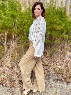 Make a splash with our Let's Go to the Beach Sheer Crochet Pullover! With its boat neck, drop shoulder, and long sleeves, this sheer crochet knit sweater is perfect for any beach day. Its great versatility allows for it to be worn as a swimsuit coverup or a stylish pullover. This is designed to be oversized, so you could size down if needed. I am in the small. Sizes: Small-Large 65% Acrylic, 35% Nylon Bohemian Open Knit Sweater For Day Out, Vacation Long Sleeve Pointelle Knit Crochet Top, Vacation Pointelle Knit Long Sleeve Sweater, Long Sleeve Knit Top For Beach In Fall, Vacation Long Sleeve Pointelle Knit Sweater, Long Sleeve Pointelle Knit Crochet Top For Vacation, Knit Crochet Long Sleeve Top For Day Out, Long Sleeve Knit Top For Fall Beach Occasion, Long Sleeve Pointelle Knit Sweater For Vacation