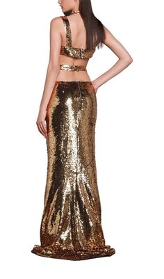 The dazzling sequins will make you the center of attention, while the two-piece design adds a trendy and playful touch. Whether it's a night out with friends or a special event, this suit is your go-to for unleashing your inner Cleopatra and owning the dance floor. So, get ready to conquer the party with style and attitude! 🎉👑 Gentle Dry Clean Only Colour may vary due to lighting on images. The product images (without model) are closest to the true colour of the product.Item runs true to size Glamorous Fitted Embellished Sets, Glamorous Sparkling Sequin Fabric For Gala, Glamorous Festive Sequin Dress For Night Out, Embellished Fitted Sets For Night Out, Glamorous Embellished Sequin Fabric For Night Out, Glamorous Embellished Sets For Party Season, Glamorous Embellished Sets For Party, Gold Sets For Party Season, Sparkling Sequin Fabric For Gala Night Out