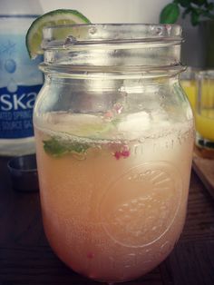 a mason jar filled with lemonade and lime