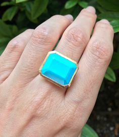 "A genuine large rectangular-shaped faceted Blue Turquoise, Robins Egg Blue Hue aka Sleeping Beauty, set on a minimalist bezel is a great statement/cocktail ring. Made to order in your choice of metal 14k Yellow Gold, Rose Gold or White Gold FINAL SALE Instagram Video ----------------- https://instagram.com/p/BiXzeTqlqIb/ https://instagram.com/p/Biuu4QnFZmJ/ https://instagram.com/p/BjstMbtlEEW/ Face measure 16mmx 18.7mm Shank width 3.5mm Sits off the finger 5.7mm ----> Please note there is an Blue Rectangular Faceted Jewelry, Blue 14k Gold Jewelry With Rectangular Stone, 14k Gold Jewelry With Blue Rectangular Stone, Turquoise Emerald Cut Gemstone Jewelry, Blue Square Cut Gemstone Jewelry, Emerald Cut Turquoise Gemstone Jewelry, Elegant Turquoise Jewelry With Rectangular Stone, Elegant Turquoise Rectangular Stone Jewelry, Formal Turquoise Rectangular Jewelry