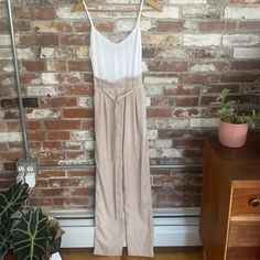 And Merci Beige And White Tie Waist Sleeveless Jumper Size S Nwt This And Merci Jumpsuit In Beige And White Is A Stylish Piece That Will Make You Stand Out In Any Occasion. It Features A Tie Waist Closure That Accentuates Your Curves And Creates A Flattering Silhouette. The Sleeveless Design And Wide-Leg Style Make It Perfect For Summer, Fall, And Spring Seasons. Made Of High-Quality Polyester, This Jumpsuit Is Comfortable To Wear And Easy To Care For. The Solid Pattern, Casual And Workwear Occa Chic Cami Jumpsuits And Rompers For Spring, Fitted High-waisted Jumpsuits And Rompers For Summer, Fitted High-waisted Summer Jumpsuits And Rompers, Sleeveless Fitted Jumpsuits For Brunch, Beige Sleeveless Fitted Jumpsuits And Rompers, Chic High-waisted Summer Jumpsuits, High Waist Jumpsuits And Rompers For Summer Workwear, Summer Fitted High-waist Jumpsuits And Rompers, Casual Sleeveless Cream Jumpsuits And Rompers