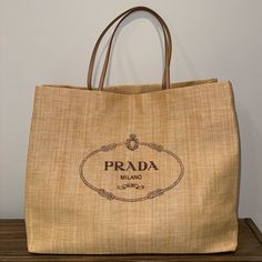 Xl Beach Tote. Largest Size Available. Raffia Tote With Leather Straps And Prada Logo. Never Used. One Of A Kind! Cannot Be Purchased Anywhere In The World! Exclusive Shopping Bag Provided Only In St Barthelemy Or Capri, Italy. Raffia Beach Bag, Prada Nylon Tote, Prada Raffia, Prada Leather Tote, Boho Decoration, Prada Tote Bag, St Barths, Vintage Tote Bag, Large Leather Tote Bag