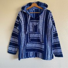 Mexican Woven Sweater New Condition This Fits More Like A Size Small In Women’s . Might Be A Size Medium In Kids Size, Being That It’s A Size M But From Mexico. Please Check Measurements Before Purchasing. Approximately 24.5” Length 21” Pit To Pit Blue Cotton Sweatshirt With Pockets, Blue Cotton Sweater For Fall, Cozy Blue Winter Sweatshirt, Casual Blue Sweater With Pockets, Casual Blue Hoodie Sweater, Blue Cotton Hooded Sweater, Blue Long Sleeve Sweatshirt With Pockets, Cozy Blue Outerwear With Relaxed Fit, Cozy Blue Long Sleeve Top