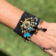 Hand embroidered by artisans in Chiapas, Mexico, these bracelets are a must have in your jewelry collection of handmade and unique. Adjustable. 8 inches long. 2 inches wide. Bohemian Jewelry Bracelet As Gift, Black Bohemian Jewelry With Evil Eye, Resizable Beaded Bracelets Gift, Black Bohemian Evil Eye Jewelry, Bohemian Resizable Cuff Bracelet For Gift, Spiritual Beaded Cuff Bracelet Gift, Bohemian Resizable Cuff Bracelet As Gift, Bohemian Resizable Cuff Bracelet Gift, Bohemian Hand-wrapped Cuff Bracelet Gift