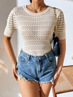 Get a perfor-mazing look with this Delphina knit top! A creamy delight boasting a perforated design, it'll be your go-to for any occasion and will make you look totally bella! Suitable for any stylish wardrobe, this top won't let you down. Size Guide: Influencer is 5’5” tall, and has a 33.4” bust, 24.7”waist, & 36.9” hips. She is wearing a S / US 4 / AU 8. This top is true to size. Material: 50% Viscose, 30% Polyester, 20% Acrylic. Key Features: Short sleeves. Crew Neckline. Soft Knit Fabricatio Hollow Out Knit Sweater For Spring, Spring Hollow Out Knit Sweater, Spring Knit Hollow Out Sweater, Spring Hollow Out Crew Neck Sweater, Chic Cream Crew Neck Knit Top, Spring Crew Neck Sweater With Hollow Out Design, Cream Short Sleeve Knit Top With Pointelle Detail, Cream Pointelle Knit Short Sleeve Top, Chic Pointelle Knit Short Sleeve Top