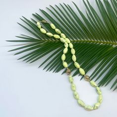 This bright lemon chrysoprase beaded necklace is a celebration of this beautiful light green stone. It is strung with two of our signature crownwork® finials and finished with an 18k yellow gold lilypad clasp. This one of a kind piece looks great layered with other necklaces or worn as a statement on its own. MATERIAL: 18k Yellow Gold STONE TYPE: Lemon Chrysoprase DIMENSIONS: 20" 18th Wedding Anniversary, Ancient Roman Coins, Swords Medieval, Gold Stone, Summer Jewelry, Lily Pads, Green Stone, Finials, Precious Metals