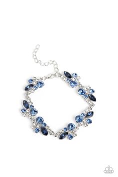 An eclectic collection of white and blue round rhinestones in varying sizes and marquise-cut gems in a blue shade cluster around the collar in high-sheen silver frames. Patterned in an abstract manner, the clusters interlock together, emitting light from every faceted angle. Features an adjustable clasp closure. Sold as one individual necklace. Includes one pair of matching earrings. Get The Complete Look! Bracelet: "Poolside Perfection - Blue" #P9RE-BLXX-239ND An eclectic collection of white an Party Jewelry With Sapphire And Sparkling Stones, Silver Cluster Jewelry For Party, Silver Cluster Party Jewelry, Blue Crystal Jeweled Jewelry, Blue Crystal Jewelry With Rhinestones, Blue Jeweled Crystal Jewelry, Blue Jeweled Party Jewelry, Dazzling Blue Evening Jewelry, Glamorous Blue Jewelry For Formal Occasions