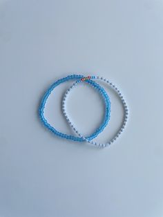 Stretchy bracelet set (2) - patterned seed bead bracelet, bright blue medium sized bracelet These bracelets come in a set of two. They are meticulously handmade with seed beads and stretchy string. The durable bracelets are all triple knotted and glued shut. DISCLAIMER ON RETURN/EXCHANGE POLICY ~ Slightly mis-shaped bracelets due to knotting of the stretchy string is NOT INCLUDED in the return/exchange policy ~ Stretched out bracelets due to use over time is NOT INCLUDED in the return/exchange policy ~ Only broken beads or broken string within the return/exchange policy window ARE INCLUDED in the return/exchange policy Royal Blue Bracelet, Pink Beaded Bracelets, Green Beaded Bracelets, Beadwork Bracelet, Turquoise Bead Bracelet, Hippie Bracelets, Purple Bracelet, Seed Bead Bracelet, Gold Bead Bracelets