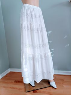 "Unique, bohemian style bridal skirt.    Boho style bridal skirt, made of white rayon with embroidered lace and 100% cotton lining. The skirt has 3 layers with an elastic waistband and cotton lining.  Material: Rayon, Cotton Available in sizes: S: 4-6, Waist:  25.5\"-26.5\", Hip: 36-37\" M: 8-10, Waist:  28\"-29\", Hip: 38-41\" Length: 38\"- 41\" The skirts are very versatile and comfortable and can be worn on the waist or low on the hips depending on personal taste." Flowy Tiered Lace Maxi Skirt, Flowy Lace Maxi Skirt For Beach, Feminine Maxi Skirt For The Beach, Lace Tiered Maxi Skirt With Ruffles, Feminine Tiered Maxi Skirt For Vacation, White Feminine Tiered Maxi Skirt, Lace Maxi Skirt With Ruffles And Tiered Design, Flowy Lace Trim Maxi Skirt For Spring, Flowy Lace Maxi Skirt With Flared Design