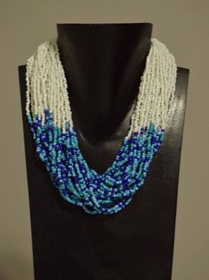 "This is Vintage Multi Strand Indian Royal Blue, Turquoise and White Beaded Necklace is adjustable and all strung on wire with a silver lobster claw clasp. This necklace was part of the Bacara Jewelry Collection of 25 years ago. This is a a lovely necklace which is lightweight to wear and will compliment any outfit and looks fabulous on. A great gift to give that special someone. Necklace 18\" long Adjustable Necklace Clasp Beads 3mm 3\" wide on each side AT BACARA WE STAND BEHIND ALL OF OUR MER Bohemian Blue Polished Beads, Seed Bead Necklaces, White Beaded Necklace, Necklace Clasp, Necklace Clasps, Bead Necklaces, Jewelry Turquoise, Overland Park, Seed Bead Necklace