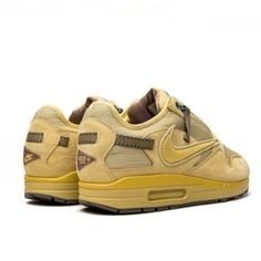 In a Saturn Gold hue, these Air Max 1 sneakers from Nike x Travis Scott offer an outdoors-inspired look. Crafted with a breathable upper, the pair is finished with signature Air cushioning underfoot for cushioned support. Travis Scott Air Max 1, Nike X Travis Scott, Gold Sneakers, Air Max 1, Travis Scott, Air Max, Nike, Yellow, Sneakers