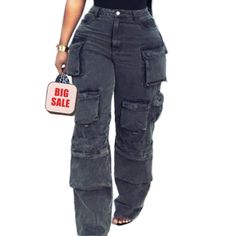 A Pair Of Cargo Pants That Are Perfect For Those Who Want To Stay Organized And Stylish. These Pants Feature Multiple Pockets That Provide Ample Storage Space For Small Items Such As Phones, Wallets, And Keys. The Straight Cut Of The Pants Provides A Classic And Timeless Look That Can Be Dressed Up Or Down, Making Them A Versatile Addition To Any Wardrobe Trendy Baggy Gray Bottoms, Trendy Gray Cargo Style Bottoms, High Waist Gray Cargo Style Bottoms, Fitted Gray Bottoms With Cargo Pockets, Trendy Gray Bottoms With Side Pockets, Gray High Waist Cargo Jeans With Pockets, Fitted Gray Cargo Pants With Pockets, Gray Baggy High Waist Cargo Jeans, High Waist Gray Cargo Jeans With Pockets