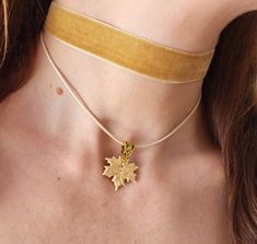 Beige velvet ribbon choker with handmade maple leaf. Material of leaf is polymer clay with using gold leaf. Length of necklace is adjustable:  10-12 inches/ 25,4 - 30,5 cm 11-13 inches/ 28-33 cm 12-14 inches/ 30.5- 35.5 cm 13-15 inches/ 33-38 cm 14-16 inches/ 35.5 cm-40.5 cm 15-17 inches/ 38,1 cm- 43,2 cm 16-18 inches/ 40.6 cm- 45.7 cm 17-19 inches/ 43 cm - 48 cm 18-20 inches/ 45,5- 50.8 cm Width of ribbon 15 mm / 0.6 inches If you need other length of necklace let me know and I will make it for you. Polymer clay isn't afraid of water, strong and non-toxic. Gorgeous gift for women and girls as handmade item ALL CHOKERS - https://www.etsy.com/shop/BuduartJewelry?ref=simple-shop-header-name&listing_id=694544029§ion_id=22629985 DROP EARRINGS WITH BLUE SPARKLY ROSES- https://www.etsy.com/listi Gold Choker With Adjustable Length As Gift, Handmade Adjustable Jewelry For Fall, Adjustable Handmade Jewelry For Fall, Beige Jewelry With Adjustable Length For Gift, Beige Adjustable Length Jewelry For Gift, Handmade Jewelry For Fall, Elegant Fall Jewelry Gift, Elegant Fall Jewelry For Gifts, Handmade Jewelry For Fall Gift