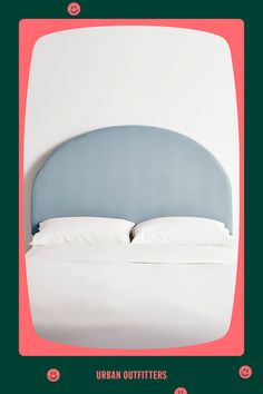 a bed with a blue headboard and white sheets on it, against a green background